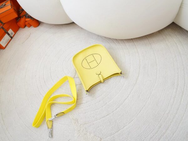 mmexport1726644621364-1 New Arrival Hermes Mini Evelyne 16CM Clemence Leather 0Y Lemoncello Silver Hardware