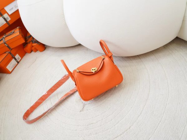 mmexport1726644679728-1 Hermes Bag Price Mini Lindy 19CM 9J Feu Orange Clemence Leather Gold Hardware