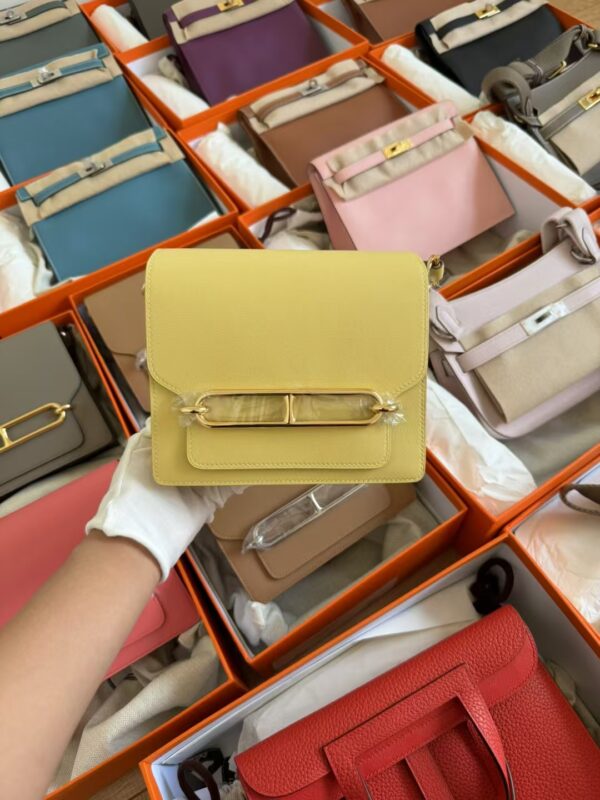 mmexport1729848025052 Hermes Roulis Mini 18CM Swift Leather 1Z Jaune Poussin Gold Hardware