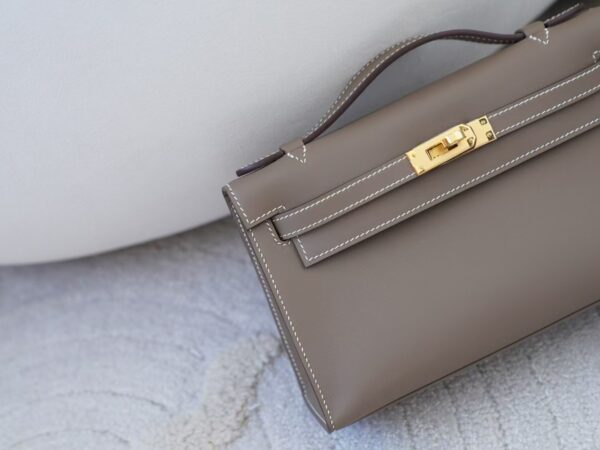 mmexport1732865839413 Women’s Clutch Bag CC18 Etoupe Swift Leather Kelly Pochette 22CM Gold Hardware
