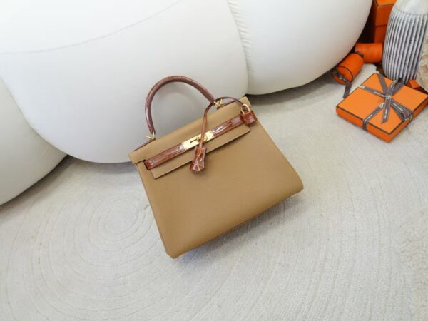 mmexport1733561180729-1 Special Order Kelly Touch 28CM Togo 0M Chai / Miel Shiny Crocodile Gold Hardware