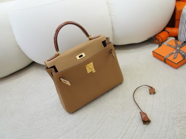 mmexport1733561198629 Special Order Kelly Touch 28CM Togo 0M Chai / Miel Shiny Crocodile Gold Hardware