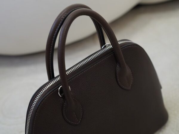 mmexport1733993977846 UK London Bolide 25CM Barenia Leather 46 Ebene Silver Hardware