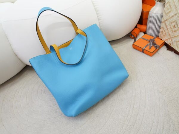 mmexport1734508278486 2024 New Hermes Double Sense Tote Bag Clemence Leather 7N Celeste / Amber